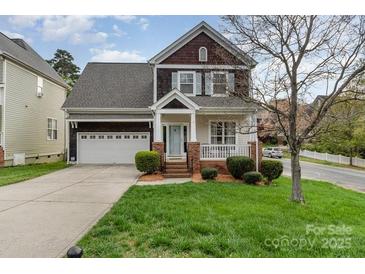 Charming two-story home with a well-manicured lawn and inviting curb appeal at 10802 Tradition View Dr, Charlotte, NC 28269