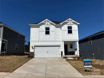 New two-story home with a white exterior, attached garage, and well-manicured lawn in a desirable community at 1279 31St St, Conover, NC 28613