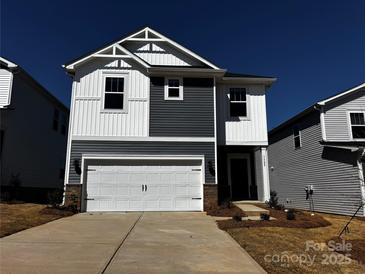 Charming two-story home featuring a two-car garage, modern color scheme and inviting front entrance at 1329 31St Ne St, Conover, NC 28613