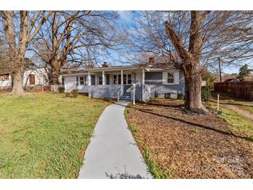 Charming home featuring a covered front porch, walkway, and nicely maintained front yard at 2418 Acapulco Dr, Gastonia, NC 28054