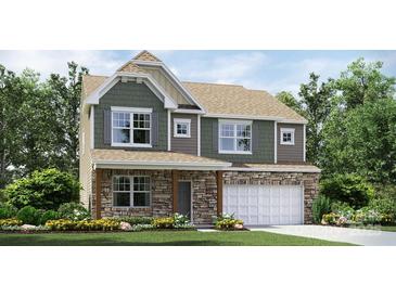 New two-story home featuring stone accents, an attached two-car garage, and a landscaped front yard at 1766 Loggerhead Dr, Lancaster, SC 29720