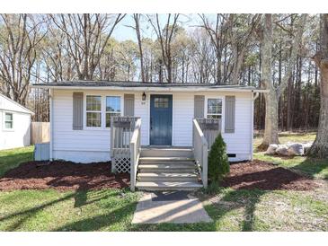 Charming home with a manicured lawn, stylish shutters, and a welcoming front porch at 517 Roberts Ave, York, SC 29745