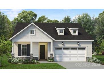Charming single-story home with a well-manicured lawn and a two-car garage at 5301 Mint Harbor Way # 0315, Charlotte, NC 28269