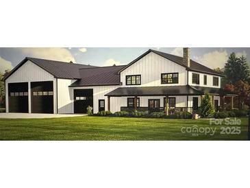 Charming two-story home with a black metal roof, covered porch, and three-bay garage at 109 Winners Cir # 1, Mooresville, NC 28117