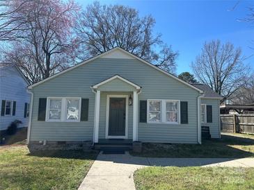 Charming single-story home with light-green siding, black shutters, and a well-manicured front lawn at 1239 Mitchell Ave, Statesville, NC 28677