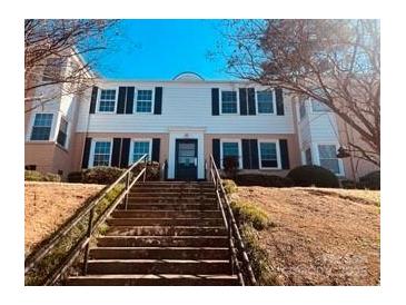 Traditional-style home with manicured landscaping at 565 Wakefield Dr, Charlotte, NC 28209