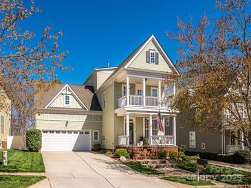 Charming two-story home with a front porch and manicured lawn, perfect for curb appeal at 151 E Morehouse Ave, Mooresville, NC 28117