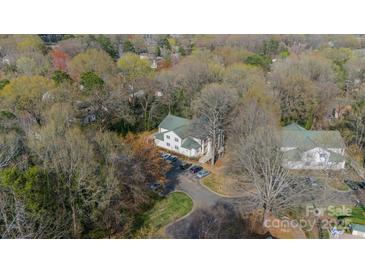 An aerial view of the building with parking, surrounded by trees at 1001 Churchill Downs Ct # A, Charlotte, NC 28211