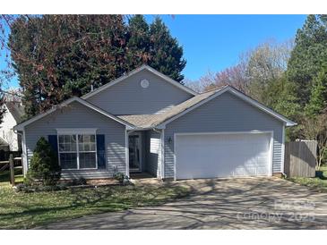 Charming single story home with a two-car garage and landscaped front yard at 127 Creston Ct, Mooresville, NC 28115