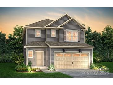 Charming two-story home with a manicured lawn, attached two-car garage and classic curb appeal at 14035 Penbury Ln # 368, Charlotte, NC 28278