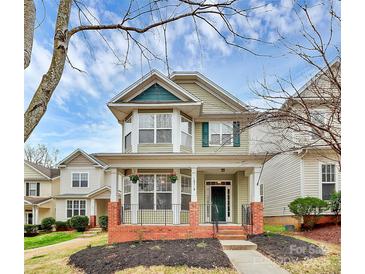 Charming two-story home with a welcoming front porch and beautiful architectural details at 18710 Coverdale Ct, Cornelius, NC 28031