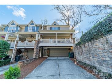 Charming two-story home with a welcoming front porch and attached garage at 2953 Craftsman Ln, Charlotte, NC 28204