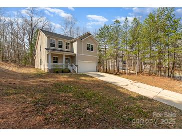 Charming two-story home featuring a cozy front porch and an attached two-car garage at 411 Wintergreen Ct # 2, Kings Mountain, NC 28086