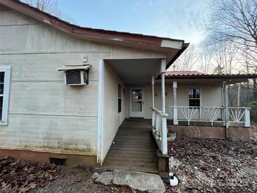 Exterior of a home with an inviting covered porch and a walkway leading to the front door at 2124 Shoal Rd, Lincolnton, NC 28092