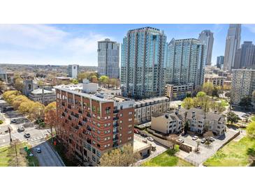 Stunning aerial view showcases urban apartments surrounded by modern architecture and city skyline at 715 N Church St # 503, Charlotte, NC 28202
