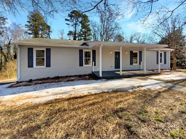 Charming single-story home featuring a covered front porch and freshly painted exterior with navy blue shutters at 510 Newport Dr, Salisbury, NC 28144