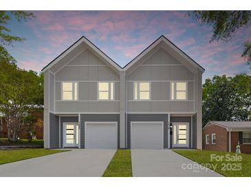 Charming newly built townhomes with individual garages and front entrances nestled in a cozy neighborhood at 1322 Condon St, Charlotte, NC 28216