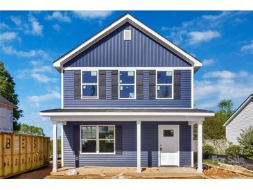 Charming new construction home featuring blue siding, black shutters, and a welcoming front porch at 513 Harrel St, Salisbury, NC 28144