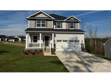 Charming two-story home featuring a welcoming front porch and a convenient two-car garage at 103 High Rock Ct # 11, Statesville, NC 28677