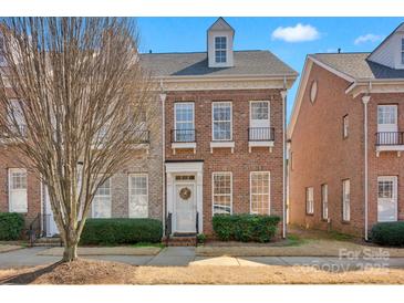 Charming brick two-story home with a well-maintained front yard and inviting entrance at 14946 Shinner Dr, Huntersville, NC 28078