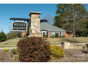 A charming neighborhood sign for Wessex Square is framed by a brick building with shutters at 4626 Annerly Ct, Charlotte, NC 28226