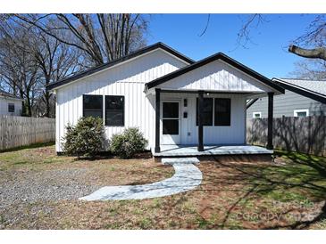 Charming home featuring a well-manicured front yard, inviting porch, and neutral modern color palette at 621 Cauthen St, Rock Hill, SC 29730