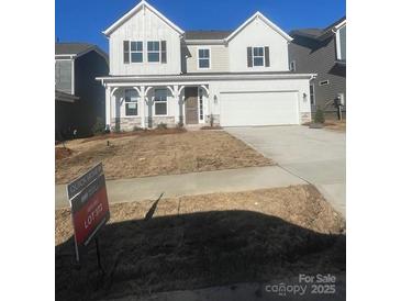 Charming two-story home boasts a two-car garage and a welcoming front porch at 119 Goorawing Ln, Mooresville, NC 28115