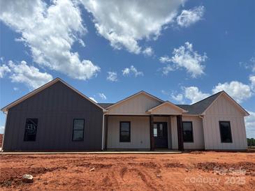 Inviting new construction home featuring a stylish two-tone exterior and covered front porch at 1370 Coppergate Dr, Salisbury, NC 28147