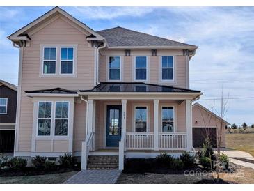 Charming two-story home featuring a welcoming front porch and manicured landscaping at 263 Luray Way # 444, Rock Hill, SC 29730