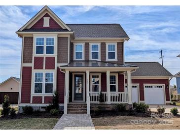 Charming two-story home with a covered porch and landscaped front yard at 267 Luray Way # 445, Rock Hill, SC 29730