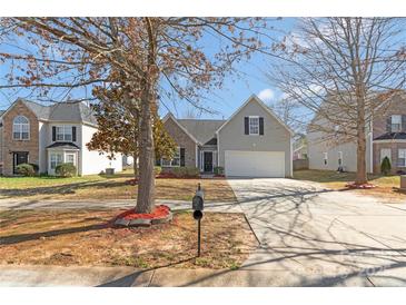 Charming home featuring a well-manicured lawn, a two-car garage, and lovely landscaping, perfect for suburban living at 1911 Kingstree Dr, Monroe, NC 28112