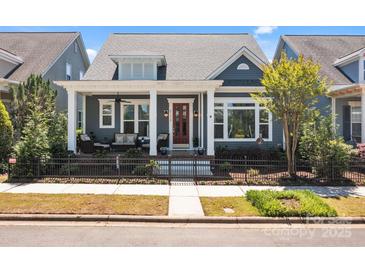 Charming home featuring a cozy front porch with comfortable seating and attractive curb appeal at 21812 Chapel Way # 20, Cornelius, NC 28031