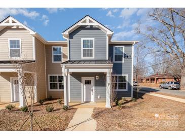 Charming two-story home features modern design, neat landscaping and a welcoming entrance at 336 F Lincoln St, Concord, NC 28025