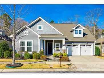 Charming single-Gathering home with a well-manicured lawn and two car garage at 1891 Felts Pkwy, Fort Mill, SC 29715