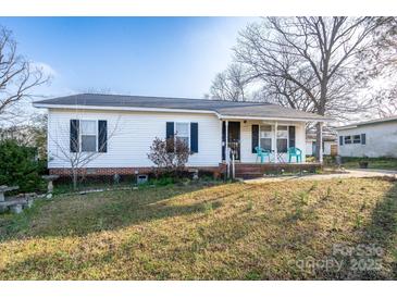 Charming one-story home with a cozy front porch and well-maintained lawn at 214 Harrel St, Salisbury, NC 28144
