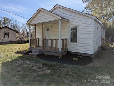 Charming single-story home with a cozy front porch, fresh landscaping, and recently painted exterior at 3703 Crawford St, Gastonia, NC 28052