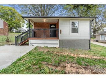 Charming single-story home with a cozy front porch, fresh paint, and black trim at 902 Grace St, Kings Mountain, NC 28086