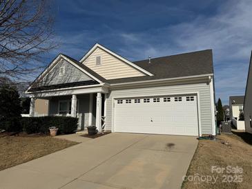 Charming single-story home featuring a two-car garage and well-maintained landscaping at 905 Roxburgh Ave, Rock Hill, SC 29732