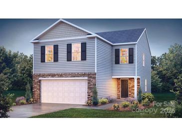 Charming two-story home with stone accents, a two-car garage, and a well-manicured front yard at 1314 37Th Avenue Ne Ln, Hickory, NC 28601