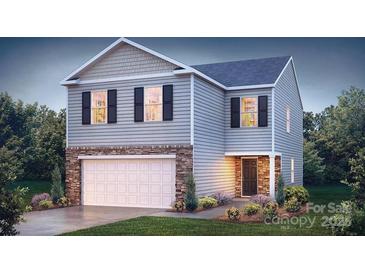 Charming two-story home with stone accents, gray siding, and a well-manicured front yard at 1443 Mammoth Rd, Hickory, NC 28602