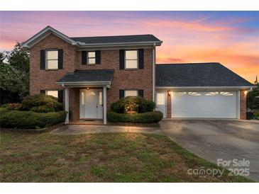 Charming two-story brick home with a two-car garage and manicured landscaping at 2082 Egret Ct, Rock Hill, SC 29732