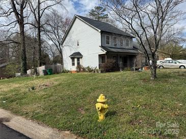 Traditional two-story home with a front porch and a well-maintained yard at 3301 Green Meadow Dr, Charlotte, NC 28269