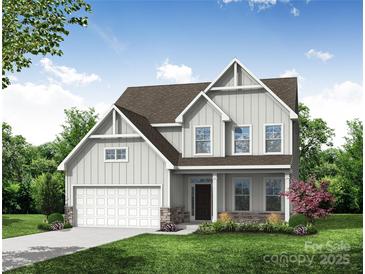 New construction home featuring a two-car garage, beautiful lawn and stone accents for an eye-catching curb appeal at 1449 Ardmore Dr # 241, Sherrills Ford, NC 28673
