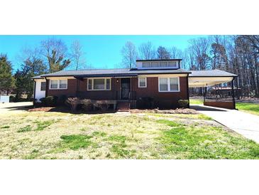 Charming brick ranch-style home with well-maintained landscaping and a convenient carport at 1730 Martin Rd, Kings Mountain, NC 28086