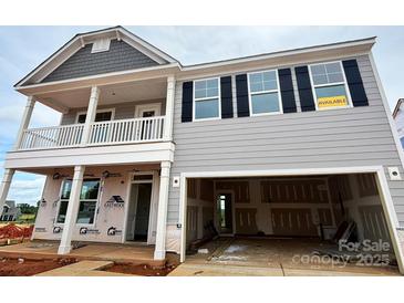 Charming two-story home with open garage, welcoming porch, and available sign at 1440 Ardmore Dr # 343, Sherrills Ford, NC 28673