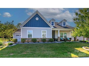 Charming single-Gathering home featuring a craftsman style, well-manicured lawn, and inviting curb appeal at 1512 Brooksland Pl, Waxhaw, NC 28173