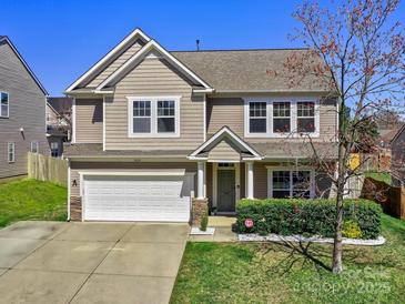 Charming two-story home featuring a two-car garage and well-manicured lawn at 3426 Dominion Green Dr, Charlotte, NC 28269