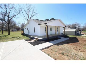 Charming renovated bungalow with a welcoming front porch and a freshly paved driveway at 1018 Union St, Maiden, NC 28650