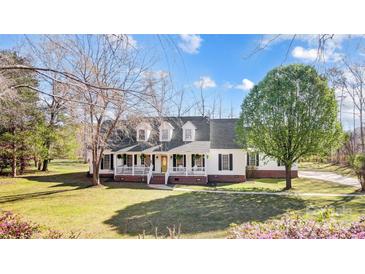 Charming two-story home with a welcoming front porch and well-maintained lawn at 737 Sanside Dr, York, SC 29745