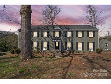Charming two-story home with a brick facade, black shutters, and well-manicured landscaping at 343 Wakefield Dr # B, Charlotte, NC 28209
